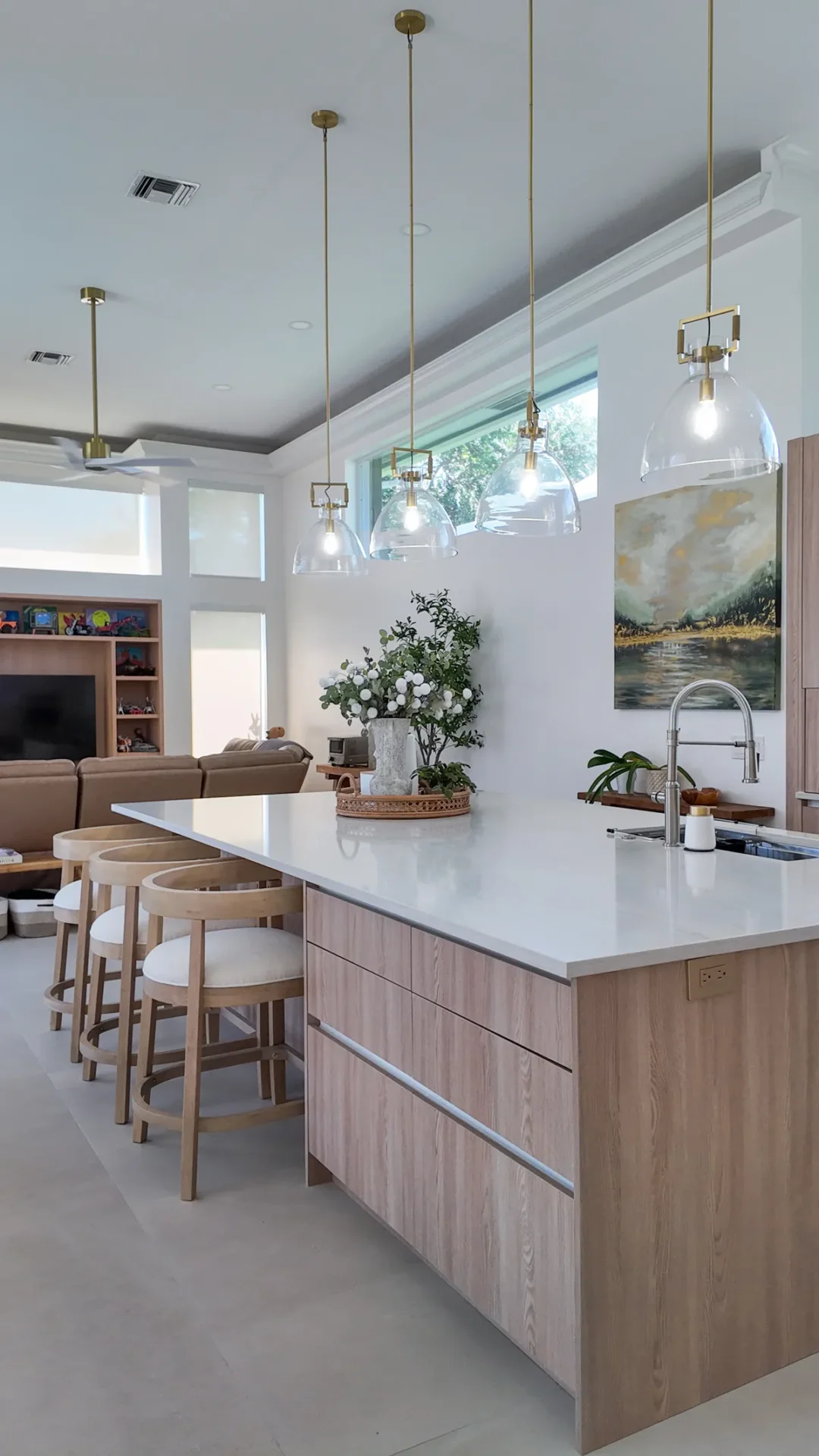 Open-plan kitchen and living room after a whole-home remodel in Palm Beach Gardens, FL