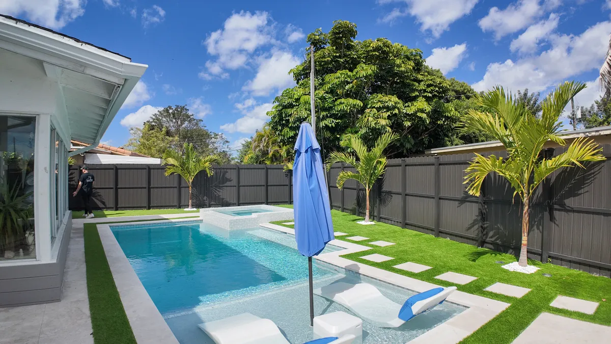 Pool coping and waterline detail on a remodeled South Florida pool by MIA Remodeling Contractors.