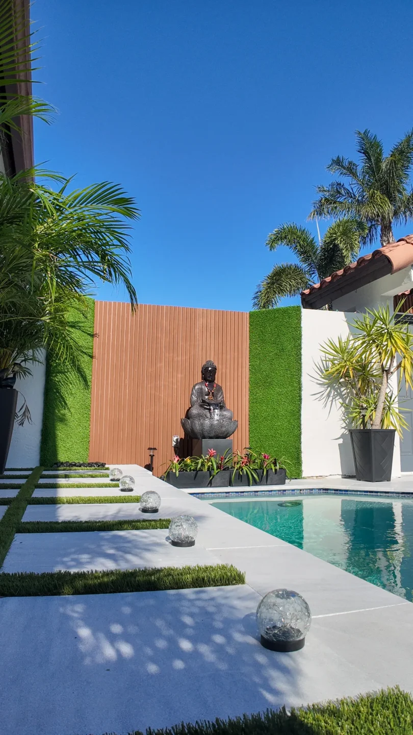 Backyard with palms and a new fence line in Hialeah, FL