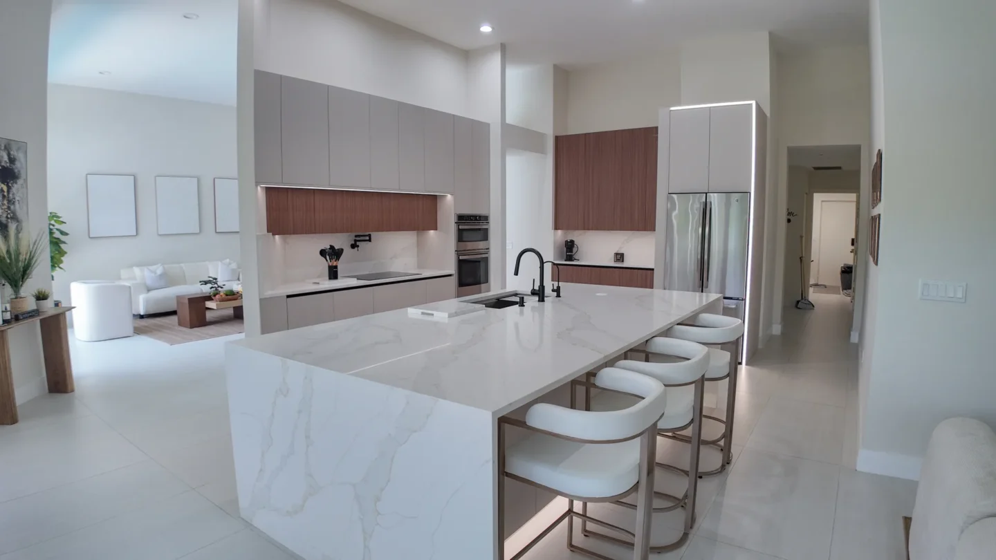 Kitchen with a marble waterfall island in Aventura, FL