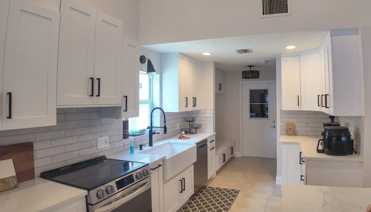 White kitchen with a farmhouse sink in Boca Raton, FL