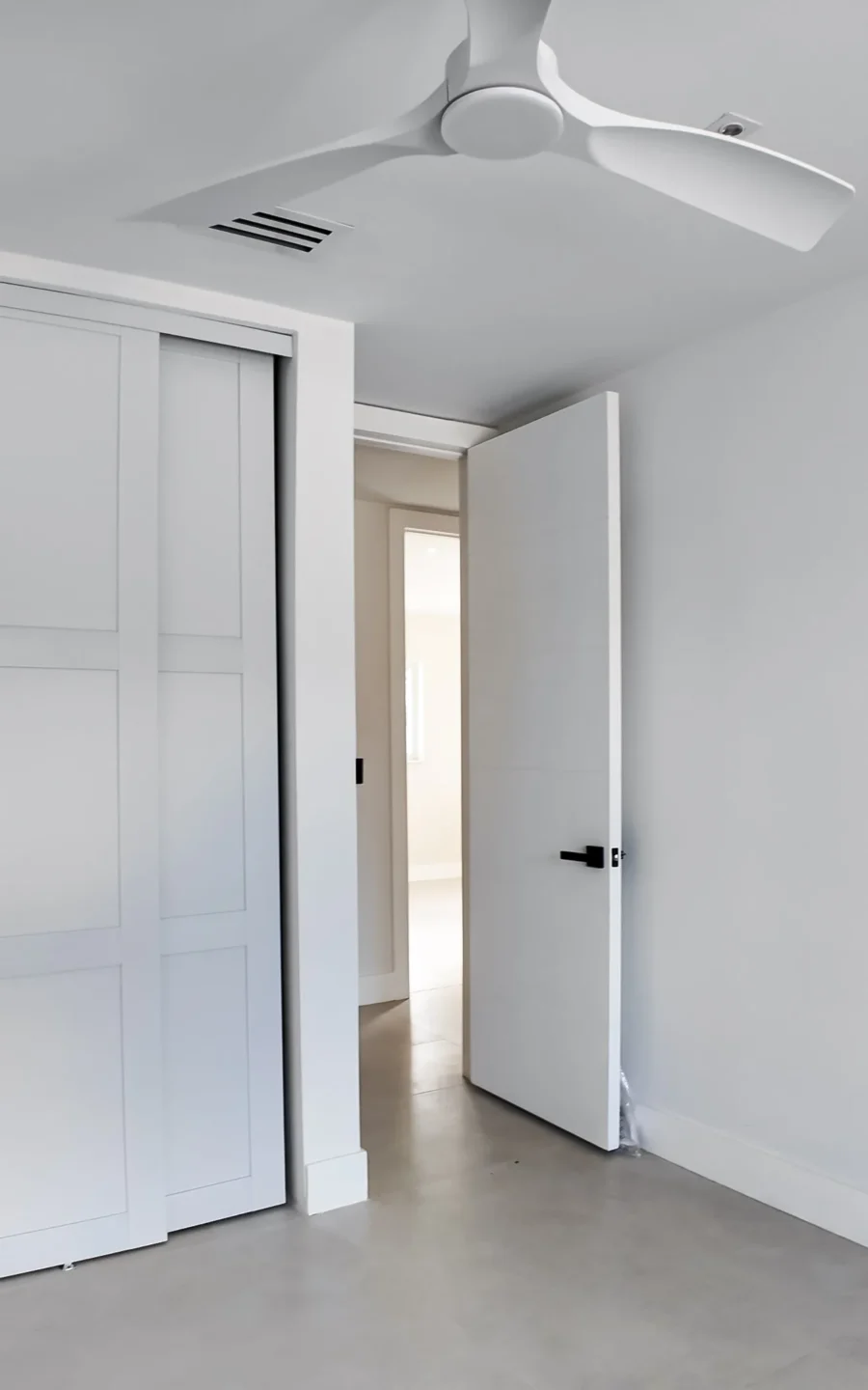Bright condo interior remodel with a sliding door and refreshed finishes