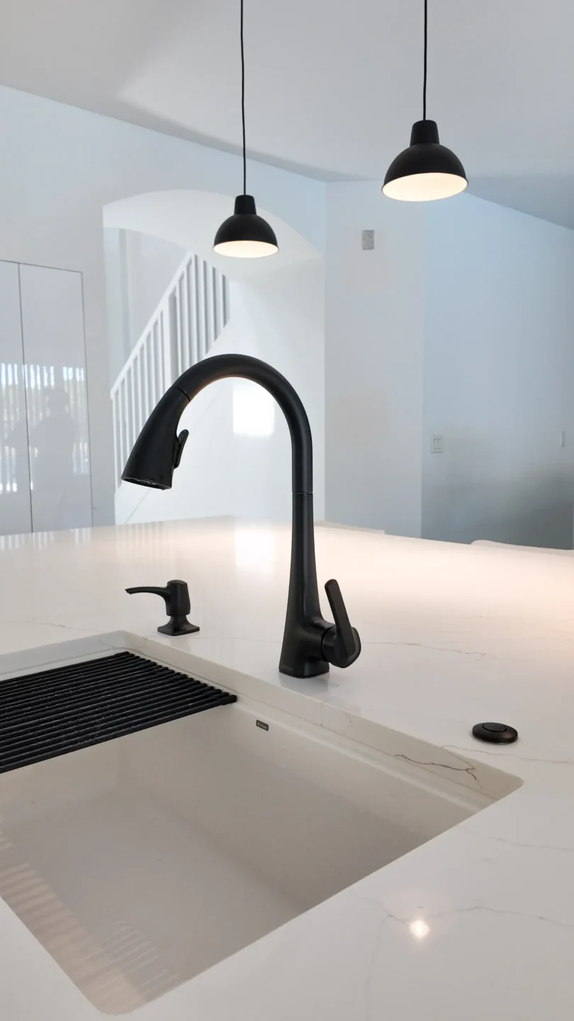 Kitchen sink and faucet in a remodel, where plumbing relocation triggers a permit
